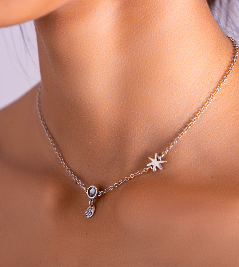 Star pendant with silver charms and an adjustable chain